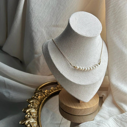 Freshwater Pearl Bar Necklace Stainless Steel Gold — styled flat lay with textures