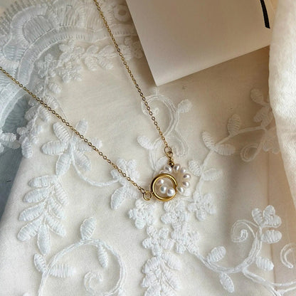 Freshwater Pearl Starburst Station Necklace Gold — styled flat lay with textures