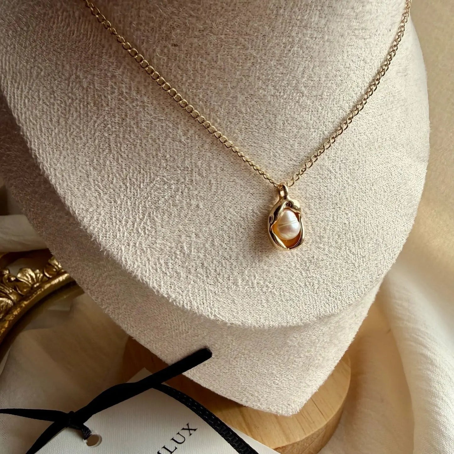 Freshwater Pearl Oval Pendant Necklace Gold Plated on neutral background — full length view