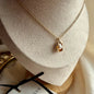 Freshwater Pearl Oval Pendant Necklace Gold Plated on neutral background — full length view