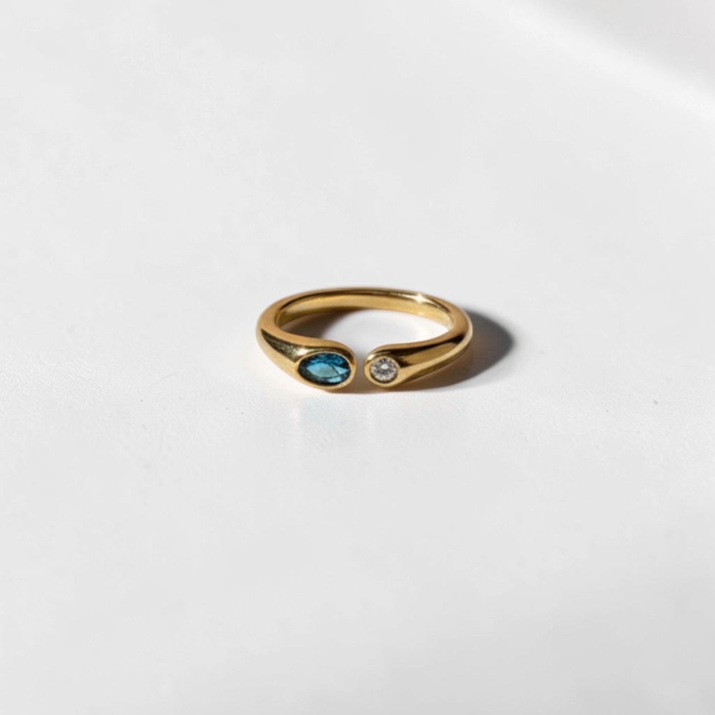 Dual Stone Toi et Moi Open Ring 18K Gold Blue Clear — styled flat lay